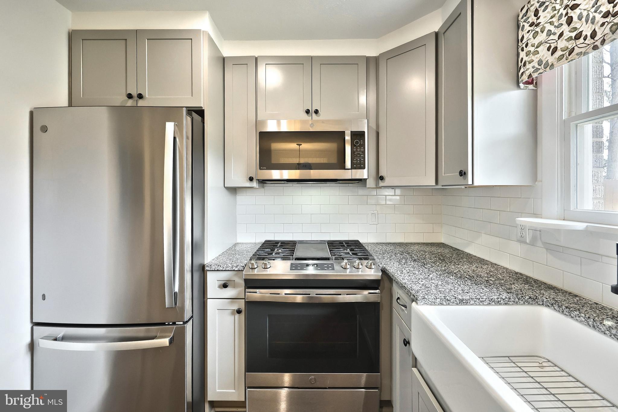 13 Circle Drive Jacobus, PA 17407 - Photo 10 of 53 a kitchen with refrigerator a microwave and stove