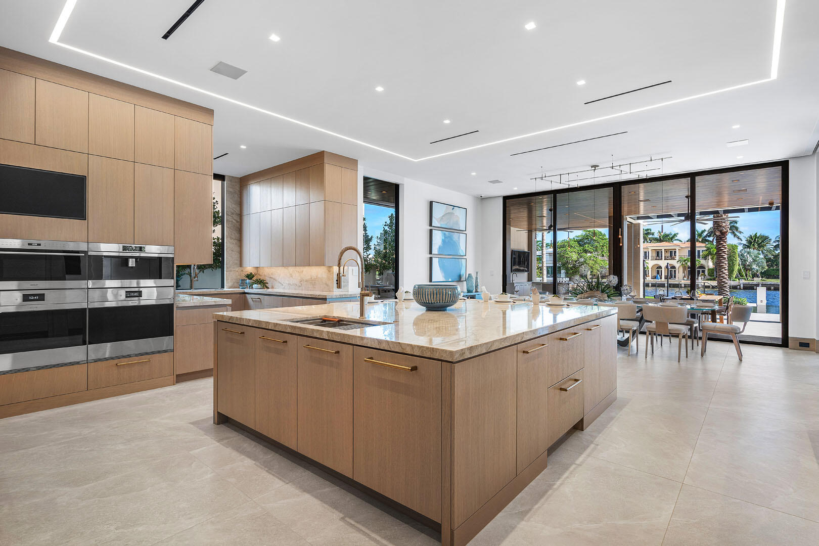 1520 Royal Palm Way Boca Raton, FL 33432 - Photo 13 of 100 a large kitchen with stainless steel appliances a lot of counter space and a sink