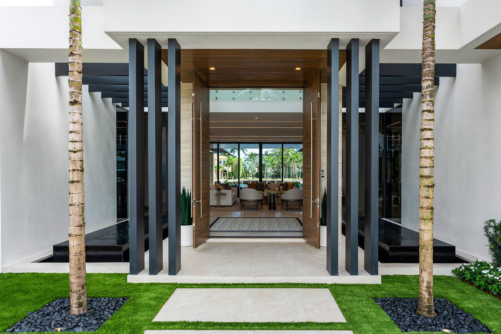 1520 Royal Palm Way Boca Raton, FL 33432 - Photo 5 of 100 a front view of a house with a porch