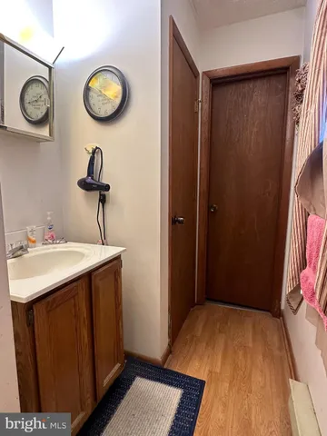 a view of a bathroom with a sink and a mirror