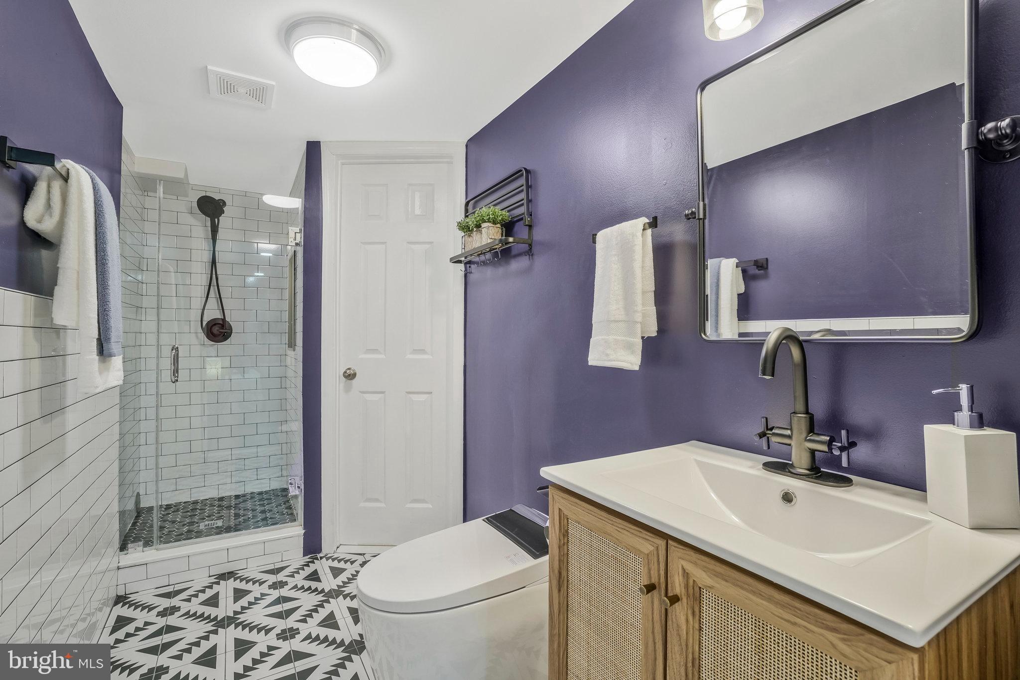 6436 Elmdale Road Alexandria, VA 22312 - Photo 33 of 46 Newly remodeled en-suite BA w/Spanish tile