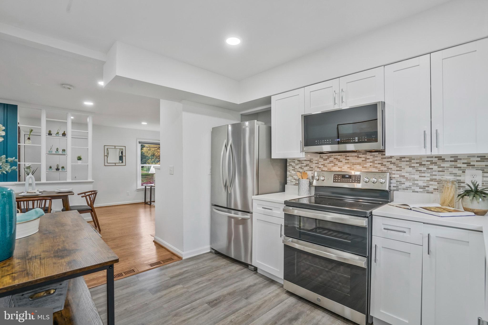 6436 Elmdale Road Alexandria, VA 22312 - Photo 9 of 46 New white cabinets offering loads of storage