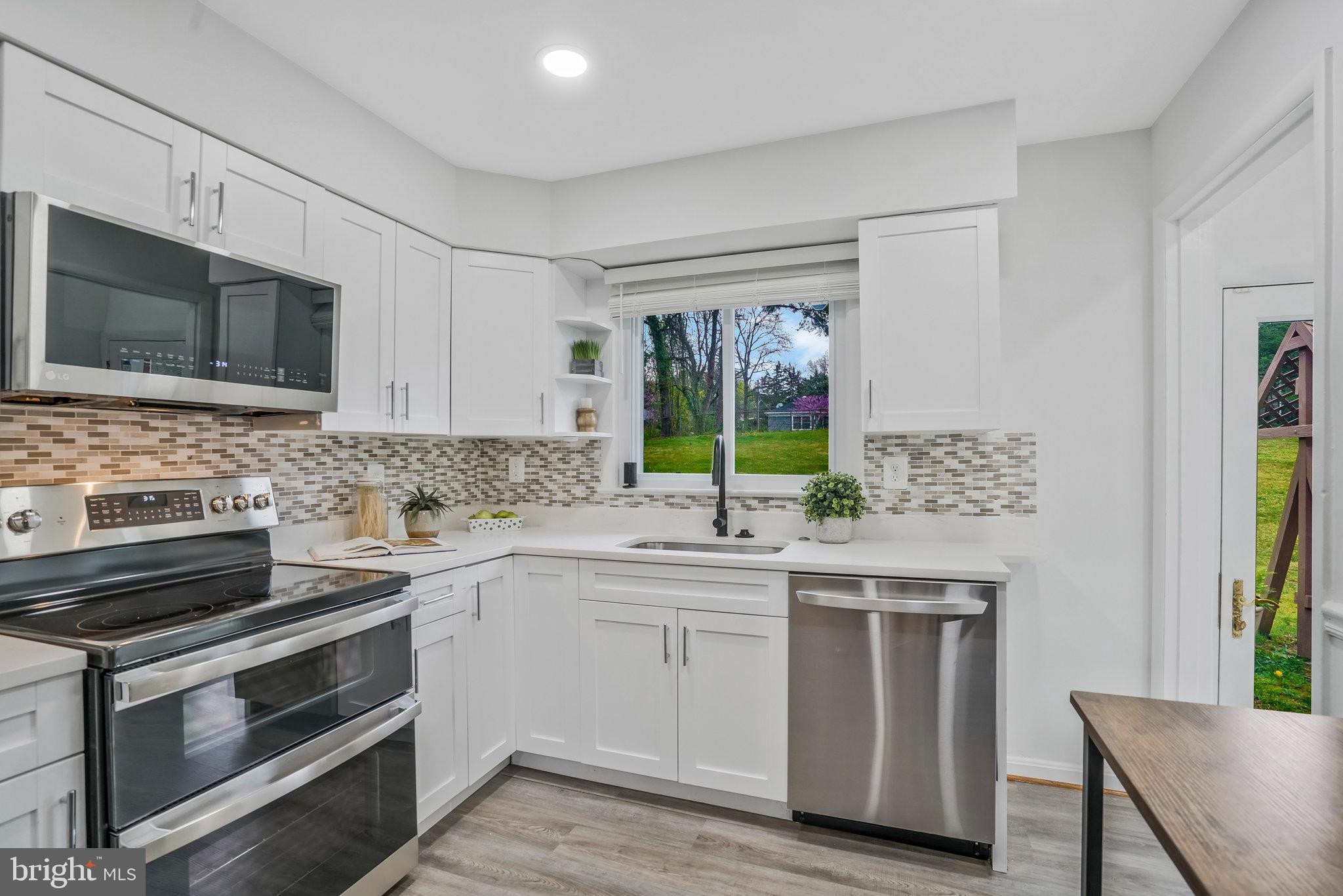 6436 Elmdale Road Alexandria, VA 22312 - Photo 10 of 46 Quartz counters + tile backsplash
