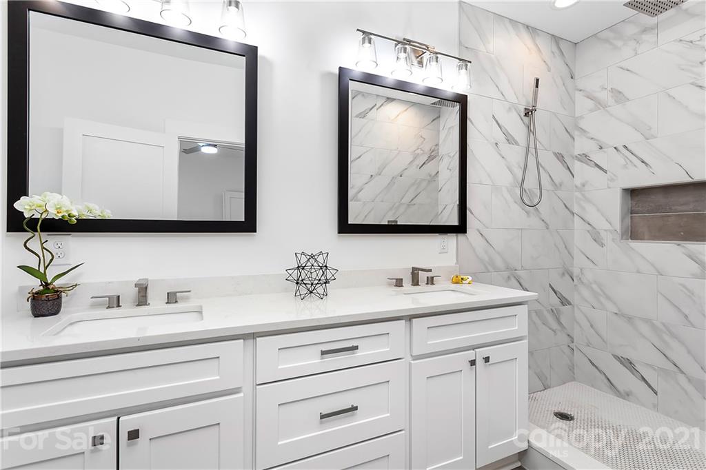3909 Plainview Road Charlotte, NC 28208 - Photo 13 of 24 a bathroom with a sink vanity and mirror