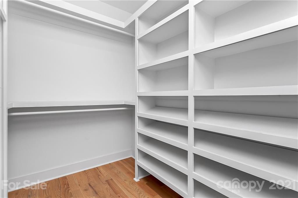 3909 Plainview Road Charlotte, NC 28208 - Photo 15 of 24 a view of walk in closet with empty racks