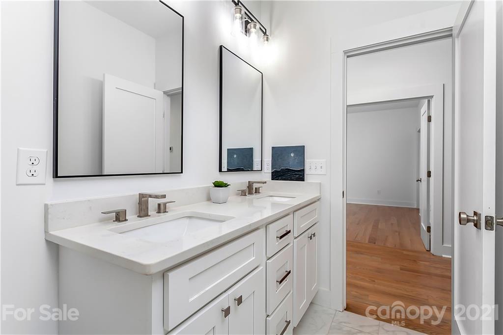 3909 Plainview Road Charlotte, NC 28208 - Photo 19 of 24 a bathroom with a sink and a mirror