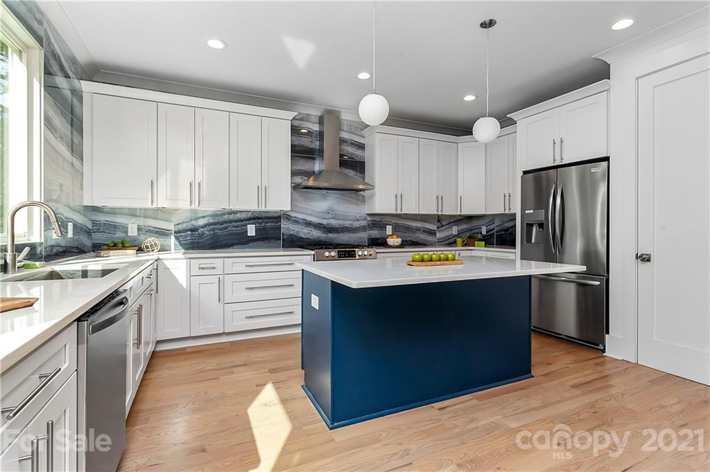 3909 Plainview Road Charlotte, NC 28208 - Photo 5 of 24 a kitchen with a refrigerator sink and cabinets