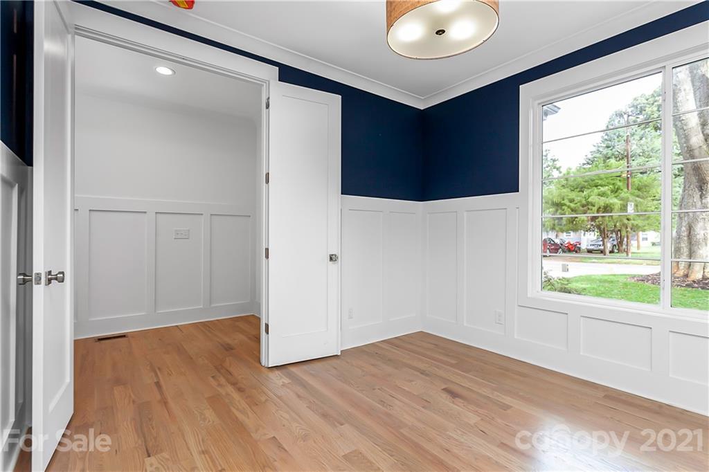 3909 Plainview Road Charlotte, NC 28208 - Photo 9 of 24 a view of empty room with wooden floor and fan