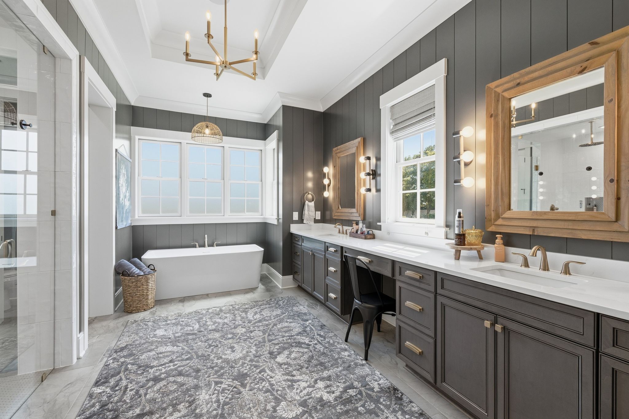 1733 Rigsby Avenue Murfreesboro, TN 37129 - Photo 24 of 57 a bathroom with a double vanity sink a large mirror and a bathtub