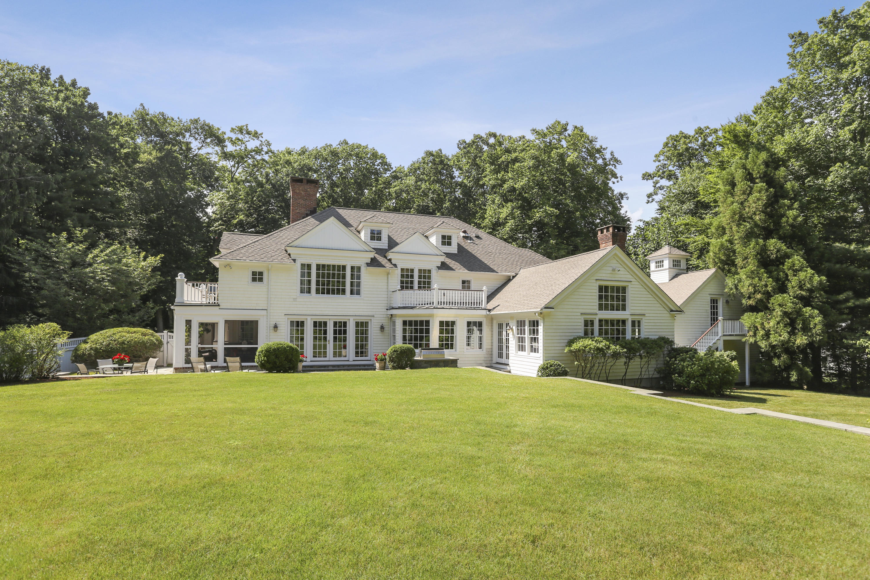 68 Inwood Road Darien, CT 06820 - Photo 38 of 43 a view of a house with a big yard and large trees