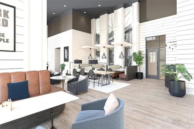 a living room with lots of furniture and wooden floor