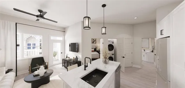 a living room with furniture and a chandelier