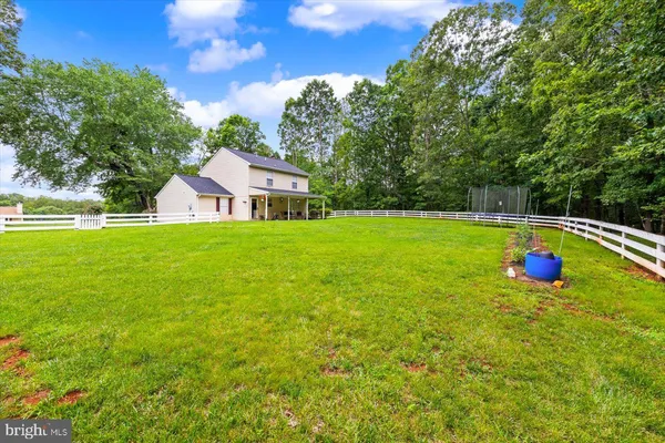a view of a house with a big yard