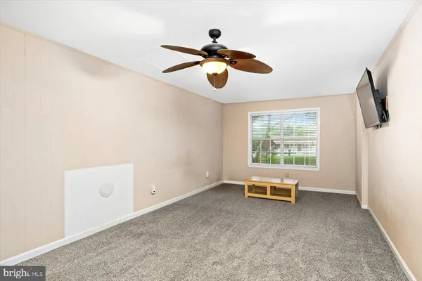 a living room with furniture and windows