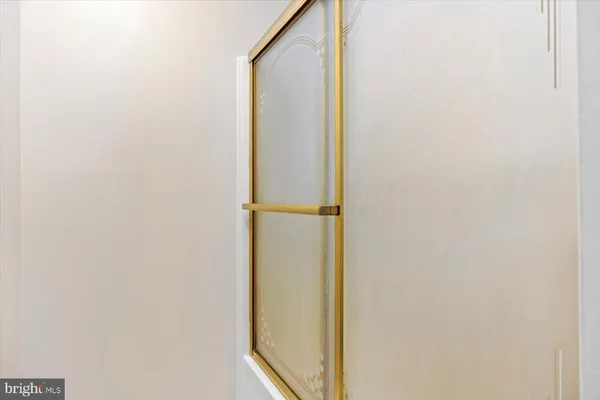 a bathroom with a glass door