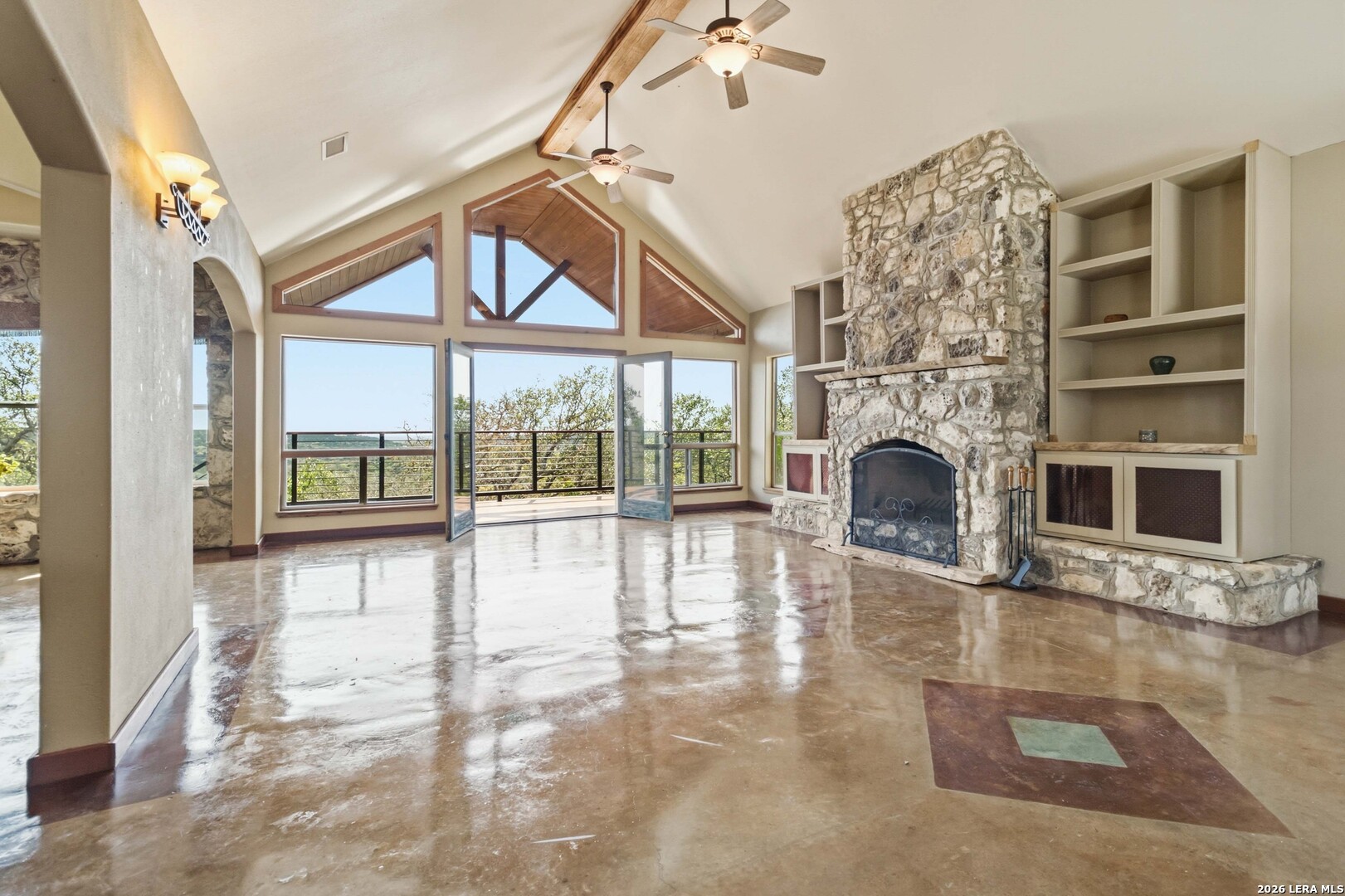 19708 Nottingham Lane Grey Forest, TX 78023 - Photo 13 of 67 a view of an empty room with a fireplace and windows
