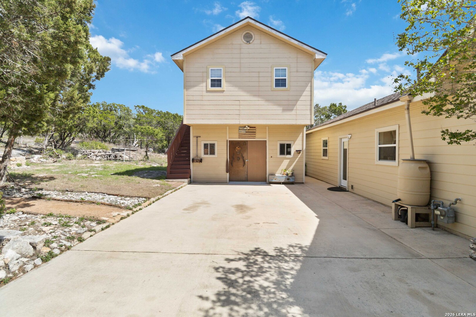 19708 Nottingham Lane Grey Forest, TX 78023 - Photo 4 of 67 a front view of a house with garden