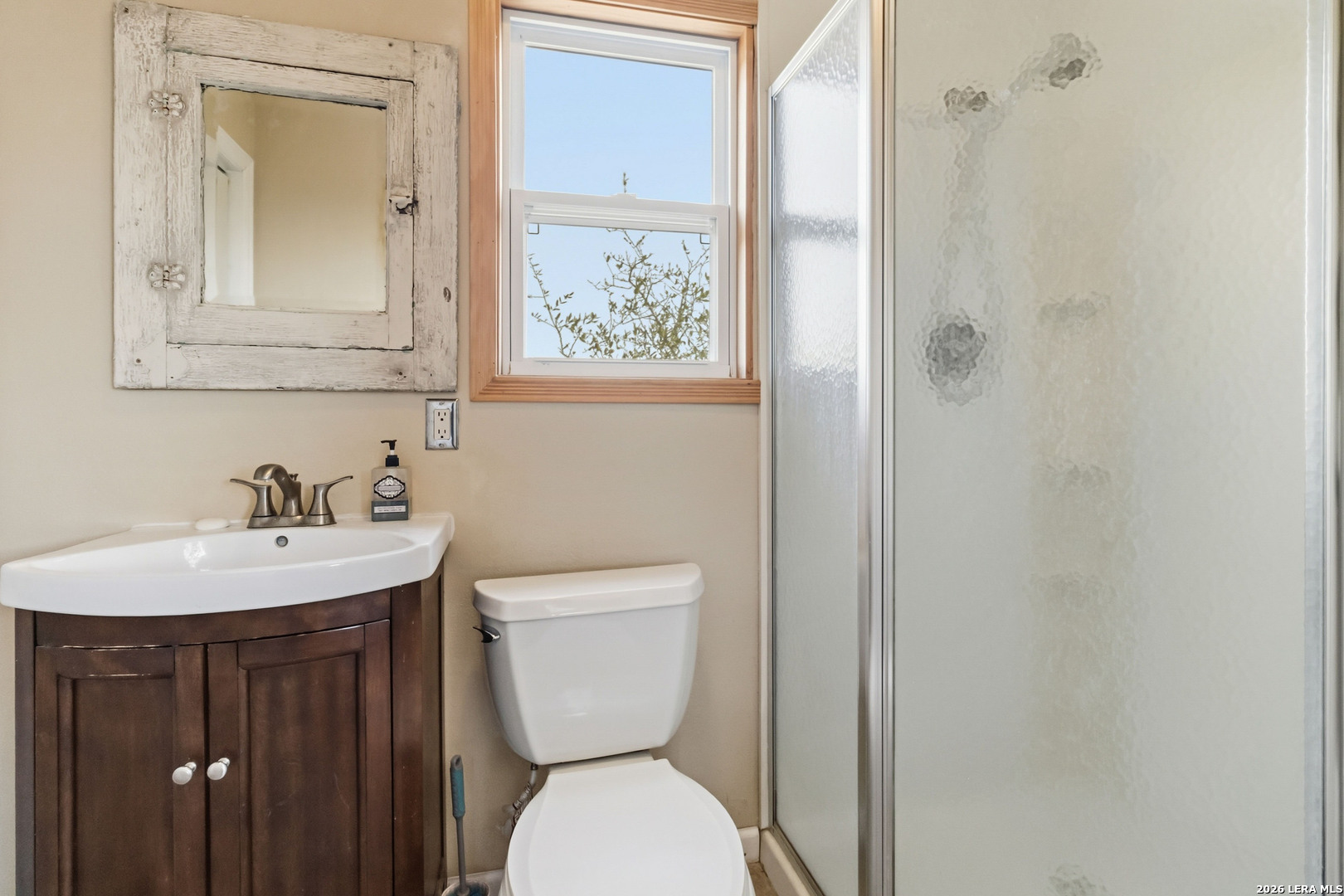 19708 Nottingham Lane Grey Forest, TX 78023 - Photo 44 of 67 a bathroom with a toilet a sink and mirror