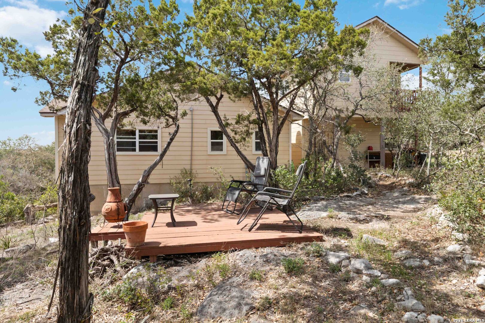 19708 Nottingham Lane Grey Forest, TX 78023 - Photo 52 of 67 a view of a backyard with plants and tree