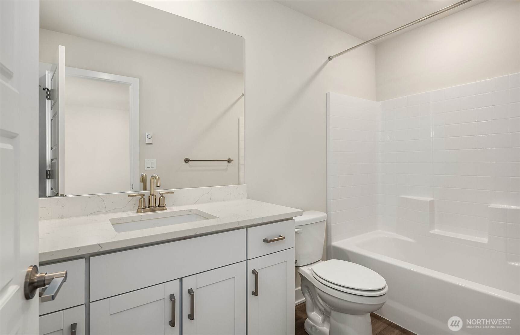 1004 243rd Place Southeast, Unit B Bothell, WA 98021 - Photo 16 of 18 a bathroom with a sink a toilet and shower