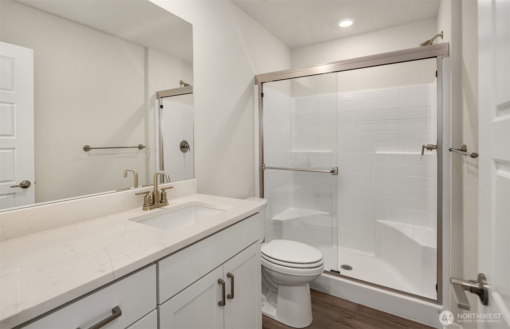 1004 243rd Place Southeast, Unit B Bothell, WA 98021 - Photo 10 of 18 a bathroom with a sink a toilet and shower