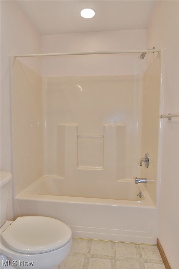 2033 East River Road, Unit 11 Newton Falls, OH 44444 - Photo 19 of 35 Bathroom with shower / bathing tub combination and light tile floors