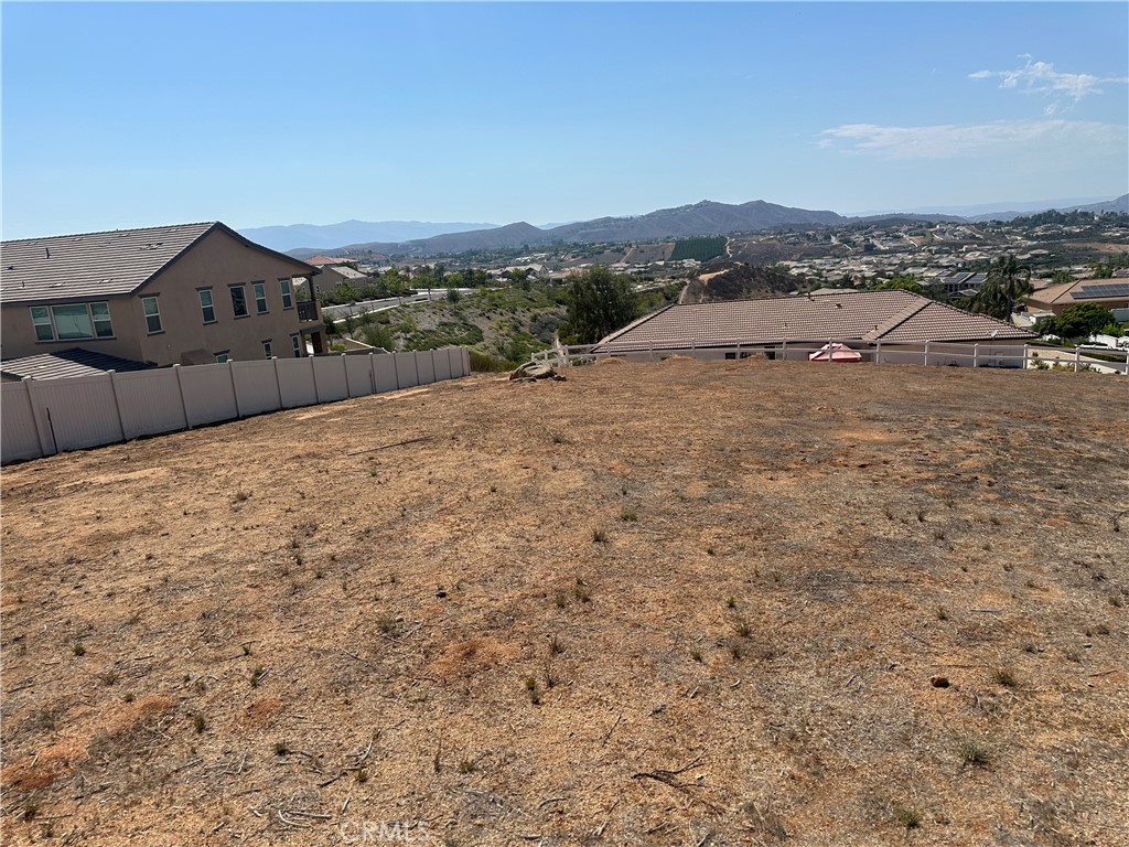 0 Dove Canyon Drive Riverside, CA 92503 - Photo 4 of 14 a view of a dry yard with wooden fence