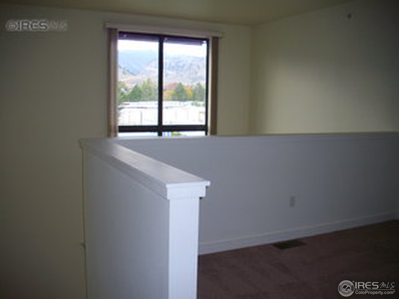 4645 Broadway, Unit C2 Boulder, CO 80304 - Photo 13 of 20 a view of an empty room with a window