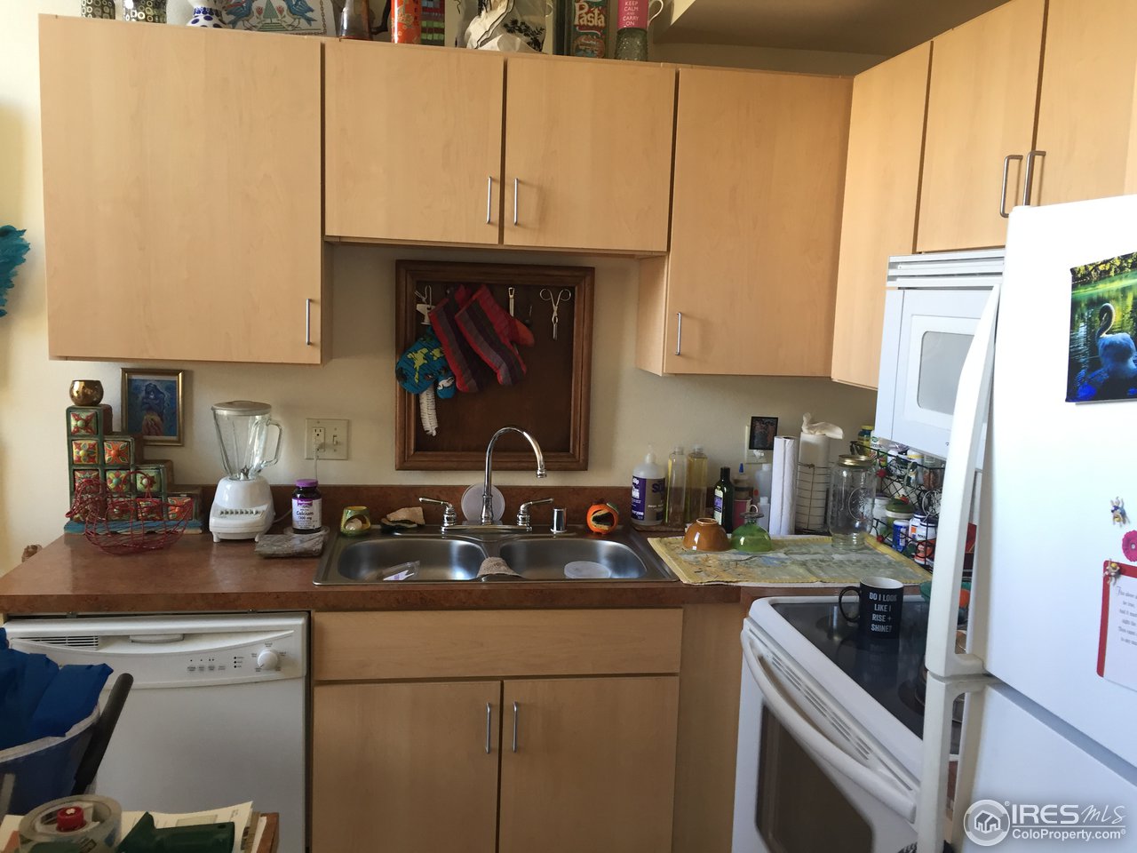 4645 Broadway, Unit C2 Boulder, CO 80304 - Photo 7 of 20 a kitchen with a sink and cabinets