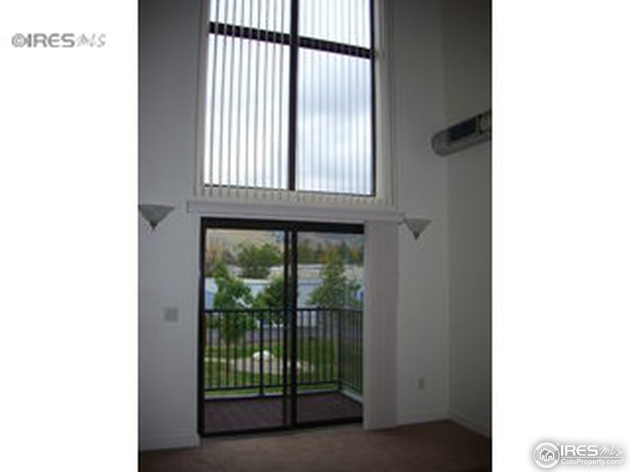 4645 Broadway, Unit C2 Boulder, CO 80304 - Photo 8 of 20 a view of an empty room with a window