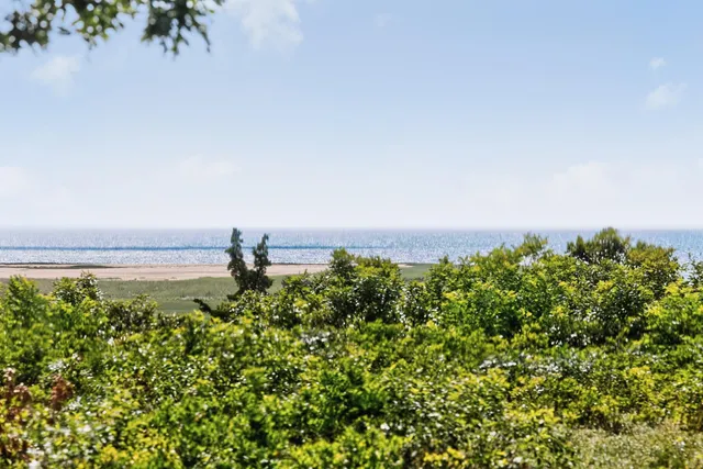 a bedroom with a bed and a lamp with window