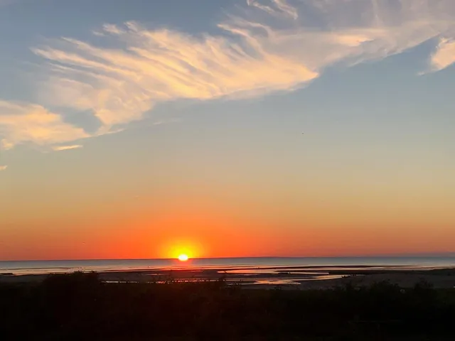 a house view with swimming pool and sitting space