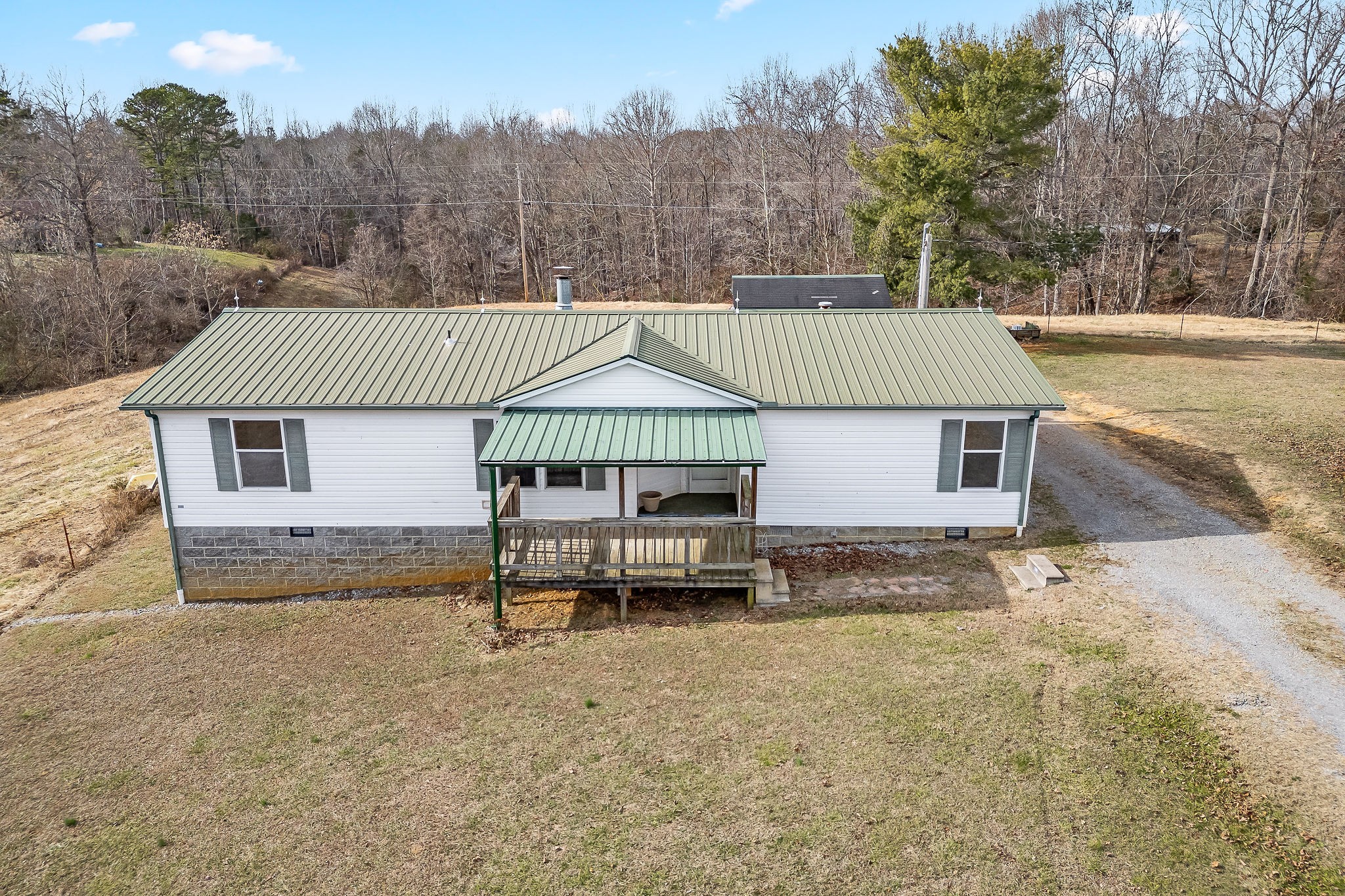 365 Poss Road Smithville, TN 37166 - Photo 4 of 20 a view of a house with a yard and sitting area