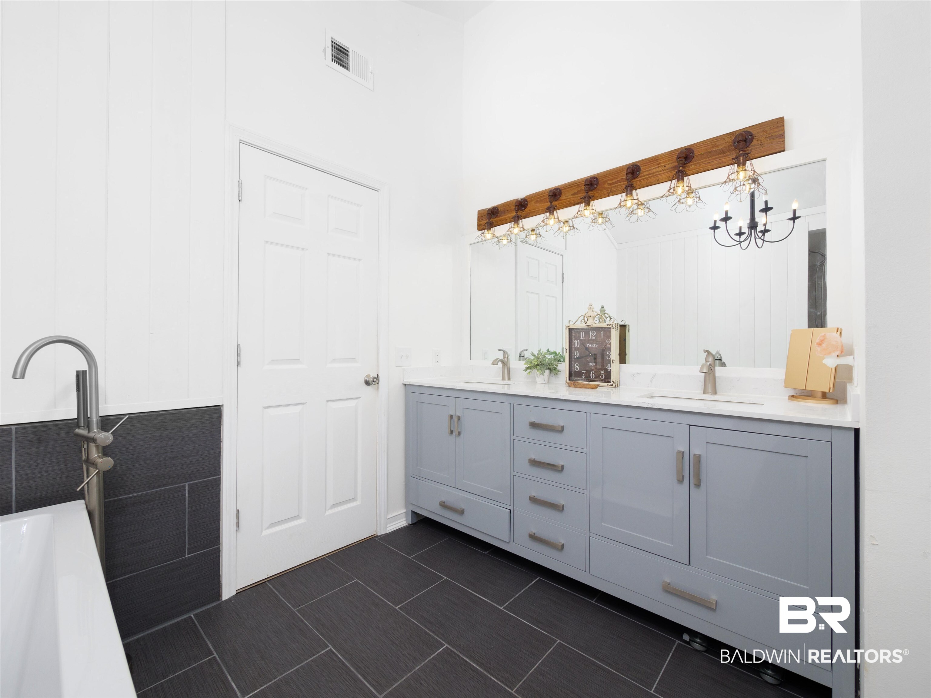494 Ridgewood Drive Daphne, AL 36526 - Photo 28 of 40 Bathroom featuring vanity, tile patterned floors, and a bathtub