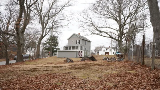 a view of a house with a snow in the yard