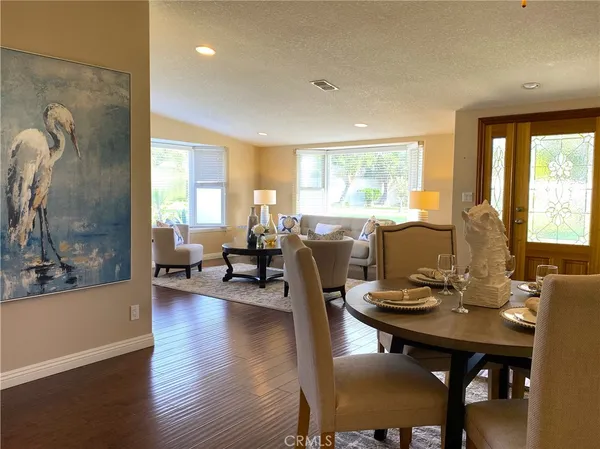 a view of a dining room with furniture and window