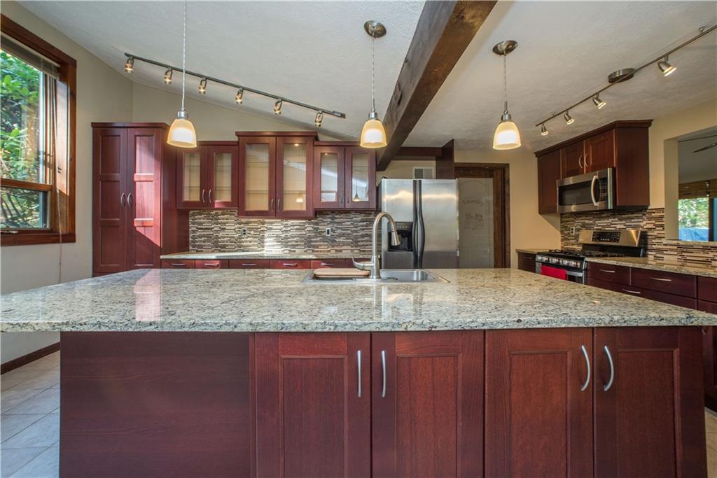 39 Buckhill Road Pittsburgh, PA 15237 - Photo 11 of 25 A 9 foot long granite island with storage underneath makes this a dream kitchen!