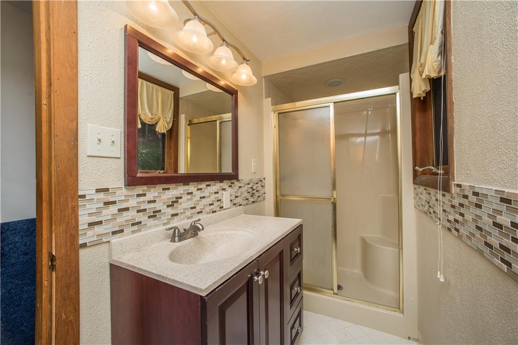 39 Buckhill Road Pittsburgh, PA 15237 - Photo 16 of 25 The updated bathroom sits conveniently between two of the bedrooms.