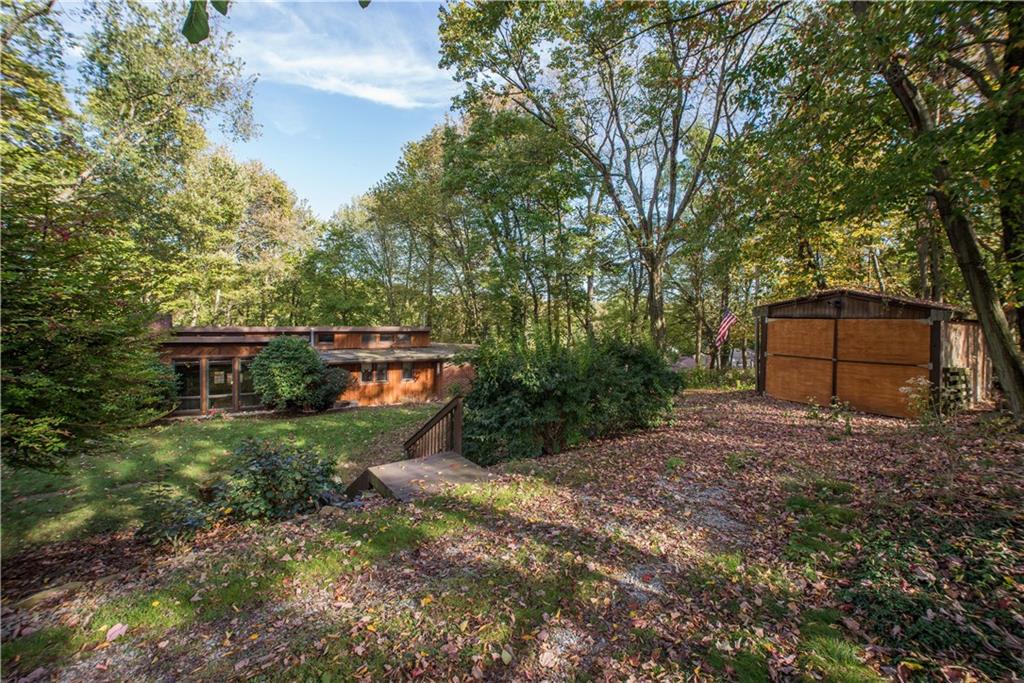39 Buckhill Road Pittsburgh, PA 15237 - Photo 3 of 25 Secluded lot includes a garage and tree lined yard.