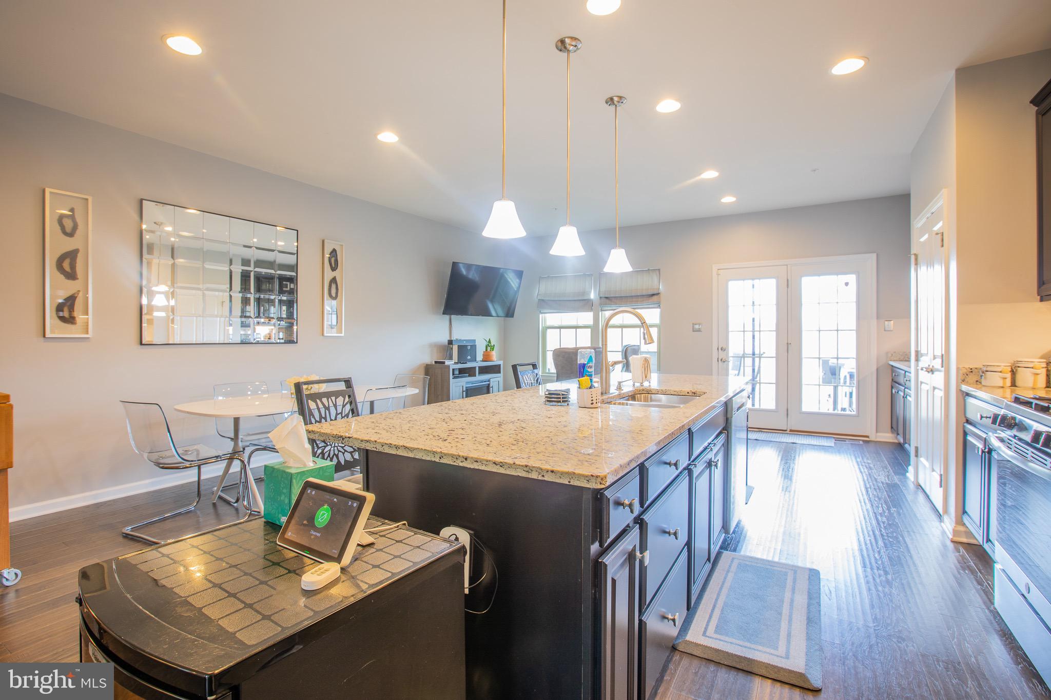 2608 Fiat Drive Hanover, MD 21076 - Photo 18 of 39 a kitchen that has a table and chairs in it