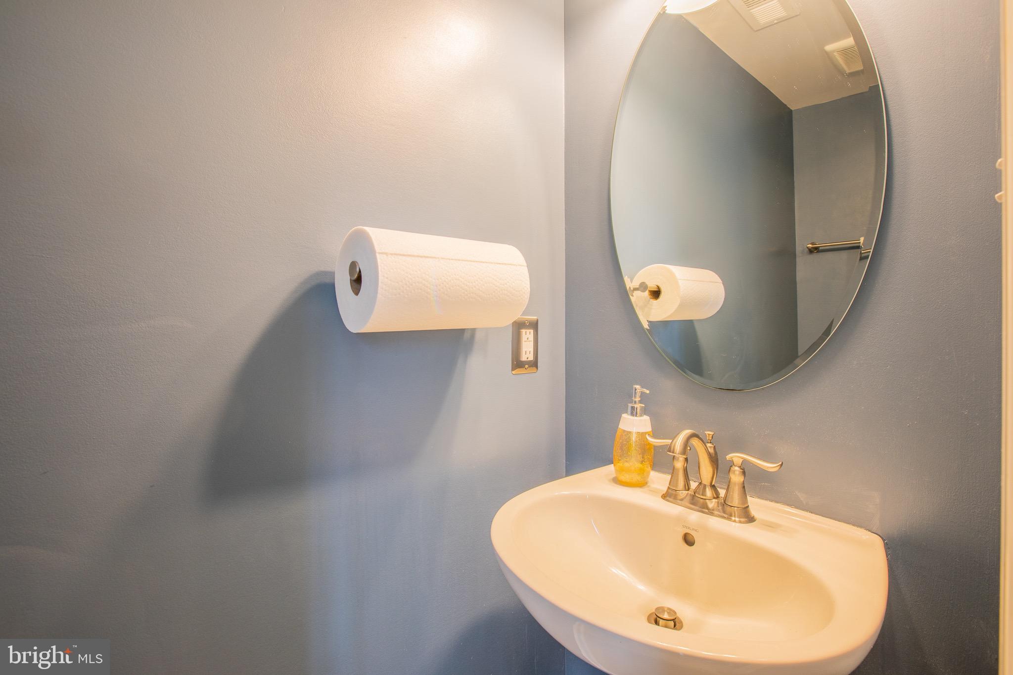 2608 Fiat Drive Hanover, MD 21076 - Photo 19 of 39 a bathroom with a sink and mirror