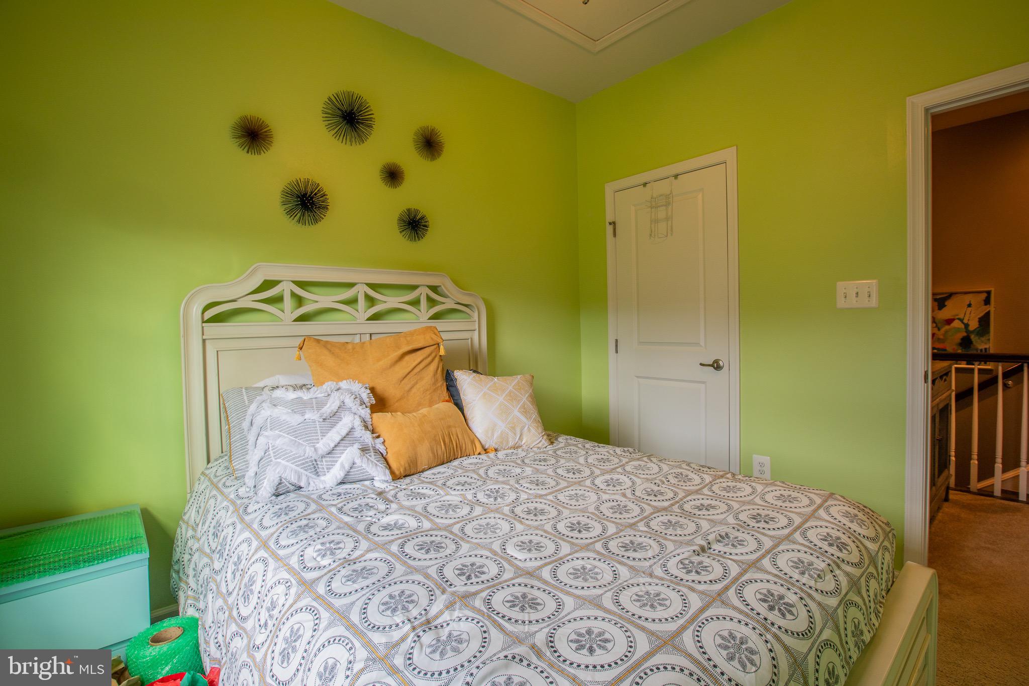 2608 Fiat Drive Hanover, MD 21076 - Photo 24 of 39 a bedroom with a bed and a painting on the wall