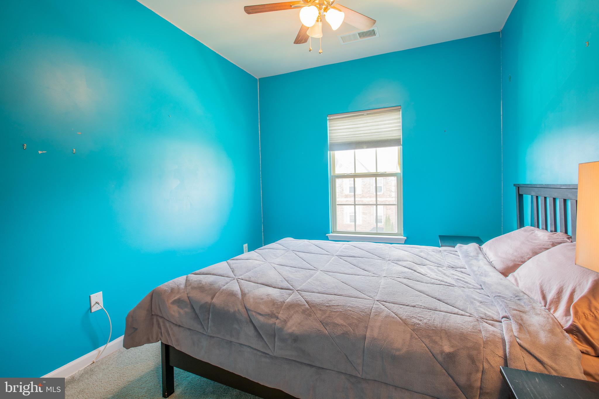 2608 Fiat Drive Hanover, MD 21076 - Photo 25 of 39 a bedroom with a bed and a chandelier