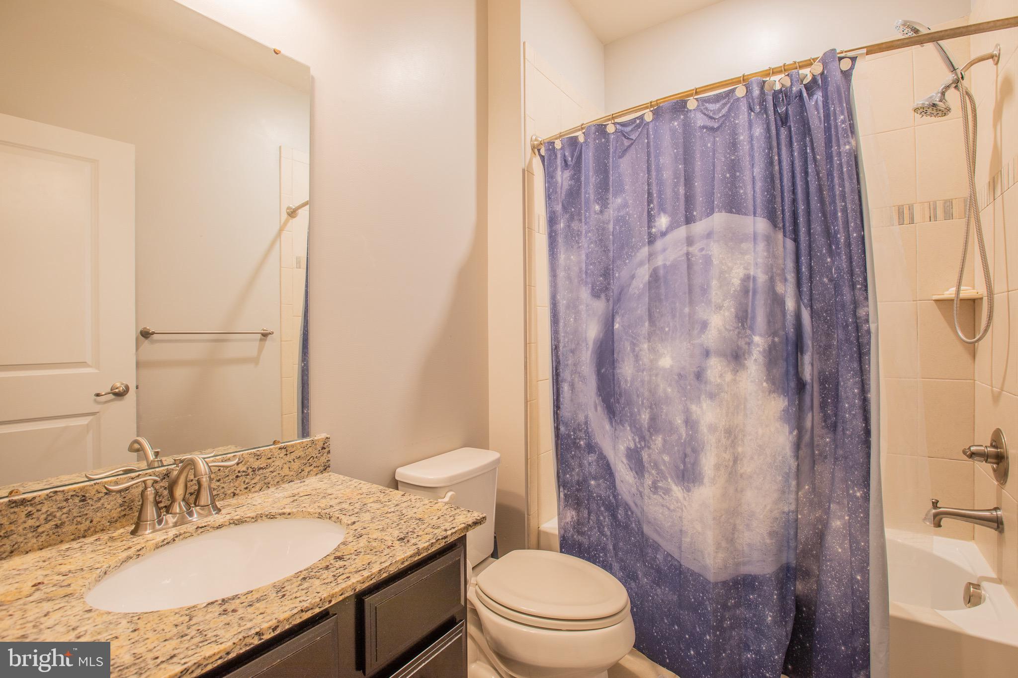 2608 Fiat Drive Hanover, MD 21076 - Photo 27 of 39 a bathroom with a granite countertop sink toilet and shower