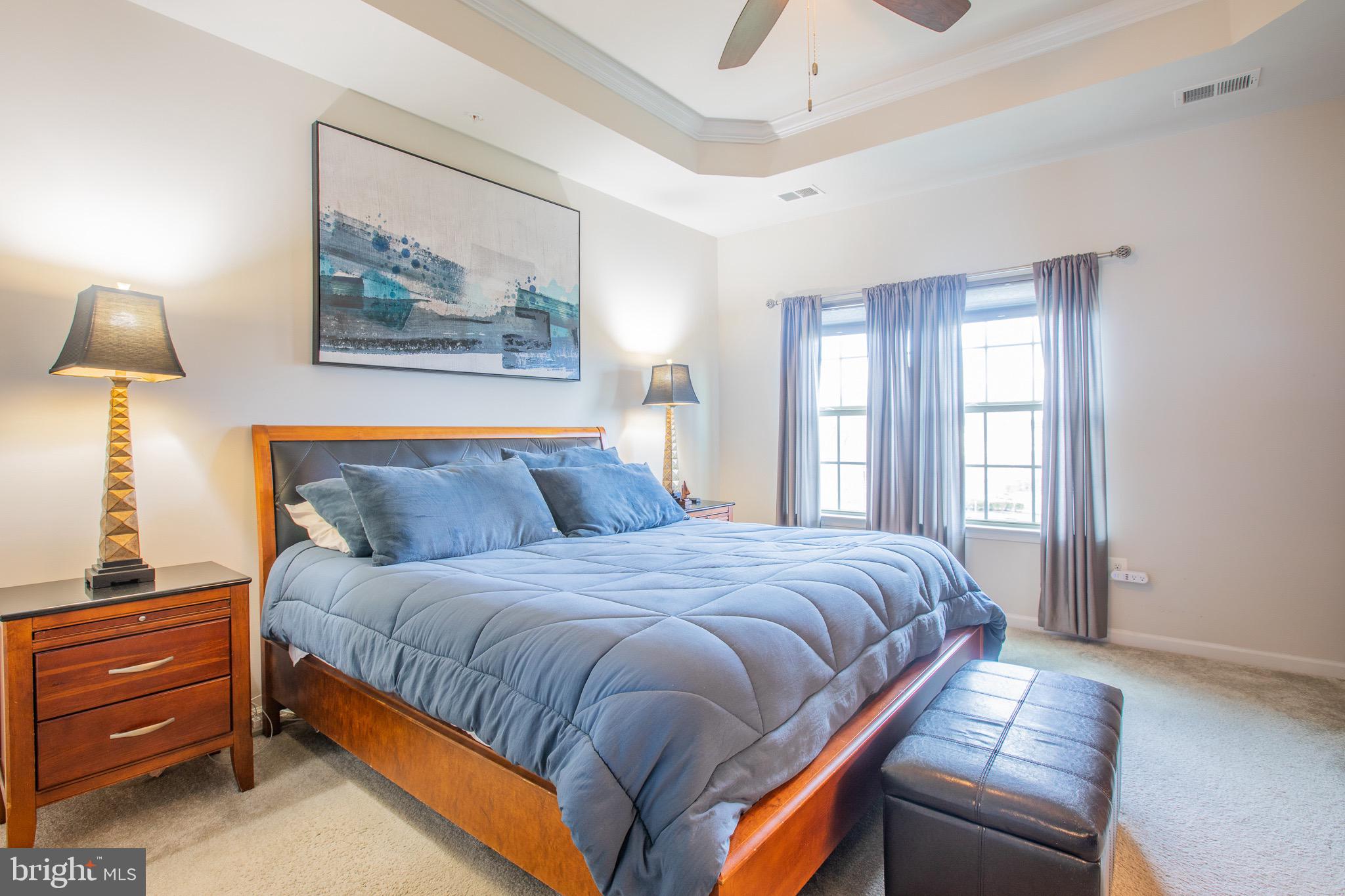 2608 Fiat Drive Hanover, MD 21076 - Photo 28 of 39 a bedroom with a bed and a chandelier