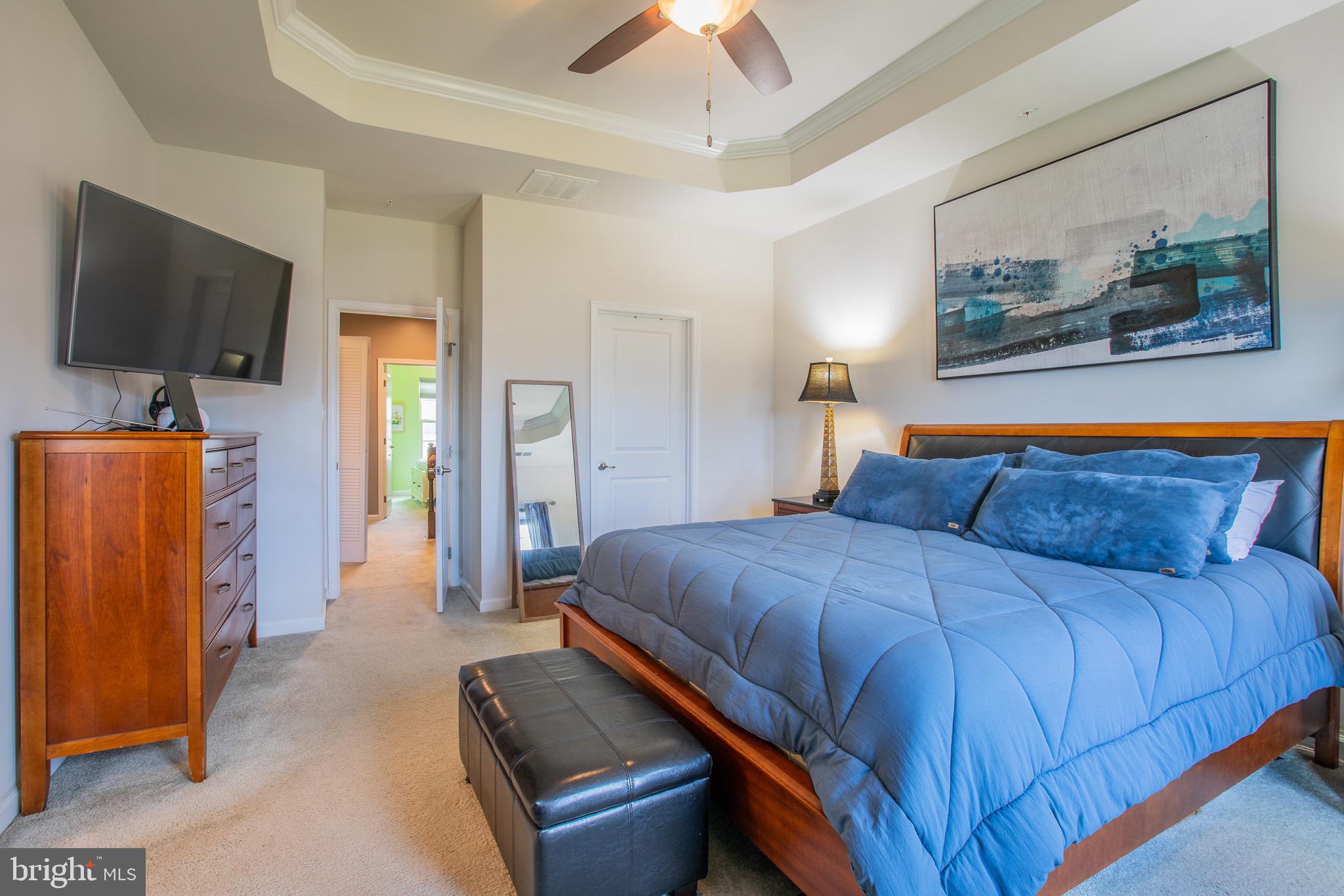 2608 Fiat Drive Hanover, MD 21076 - Photo 30 of 39 a bedroom with a bed and a flat screen tv