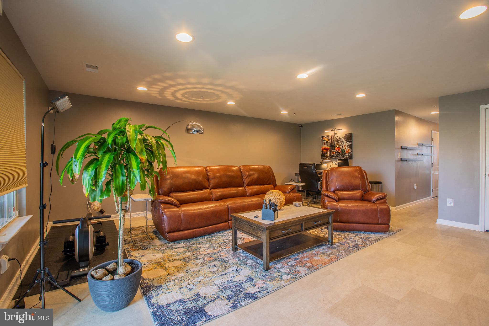 2608 Fiat Drive Hanover, MD 21076 - Photo 3 of 39 a living room with furniture a potted plant and a rug