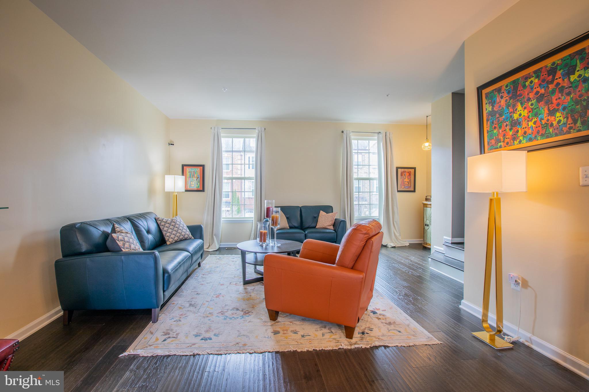 2608 Fiat Drive Hanover, MD 21076 - Photo 8 of 39 a living room with furniture and a refrigerator
