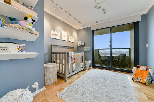 a bedroom with furniture and a window