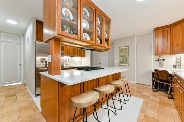 a kitchen that has a table and chairs in it
